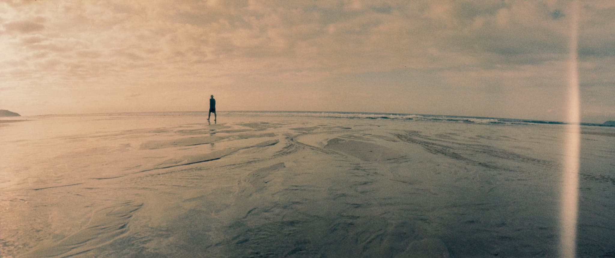 A man wanders the abyss in search of meaning but finds only texture